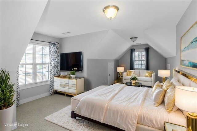 1027 Eagles Brooke Dr, Locust Grove, GA 30248 - bedroom with baseboards, vaulted ceiling, visible vents, and carpet