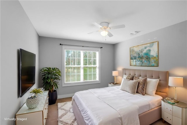 1027 Eagles Brooke Dr, Locust Grove, GA 30248 - bedroom with carpet, visible vents, baseboards, and ceiling fan