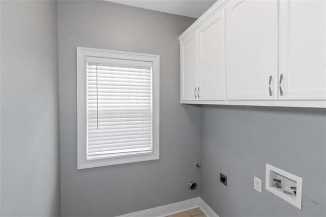 1027 Eagles Brooke Dr, Locust Grove, GA 30248 - clothes washing area with hookup for an electric dryer, gas dryer hookup, baseboards, cabinet space, and washer hookup