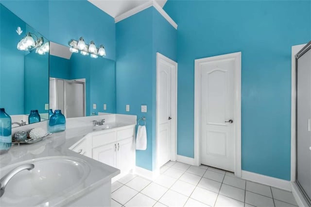 1027 Eagles Brooke Dr, Locust Grove, GA 30248 - bathroom featuring tile patterned floors, baseboards, a sink, and double vanity