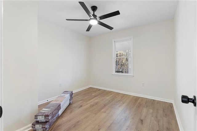 unfurnished room featuring light wood-type flooring and ceiling fan