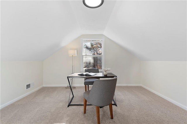 office featuring lofted ceiling and light colored carpet