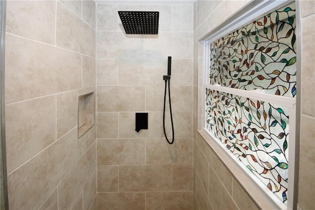 bathroom with tiled shower