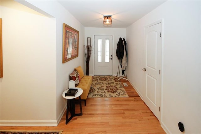 entryway with light hardwood / wood-style flooring