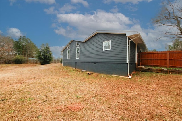 view of side of property with a yard