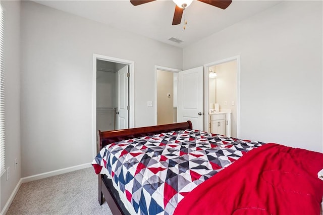 2646 Neighborhood Walk S, Villa Rica, GA 30180 - carpeted bedroom featuring a ceiling fan, baseboards, ensuite bath, visible vents, and a spacious closet