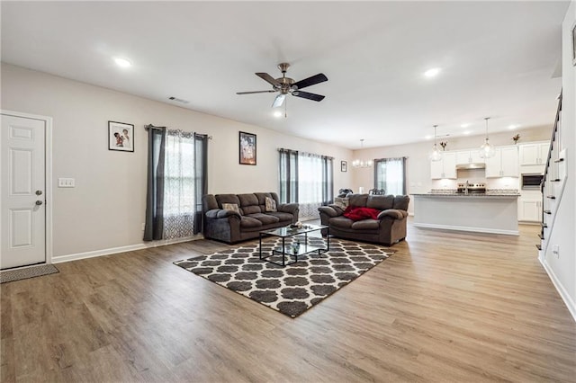 2646 Neighborhood Walk S, Villa Rica, GA 30180 - living area featuring light wood-style floors, baseboards, and ceiling fan