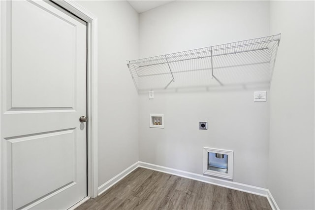 2646 Neighborhood Walk S, Villa Rica, GA 30180 - laundry area featuring baseboards, hookup for a washing machine, wood finished floors, laundry area, and electric dryer hookup