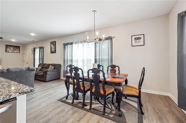 2646 Neighborhood Walk S, Villa Rica, GA 30180 - dining area with a chandelier, recessed lighting, baseboards, and light wood-style floors