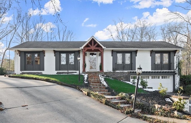 2148 Allgood Rd, Marietta, GA 30062 - ranch-style home with french doors, brick siding, a garage, and concrete driveway