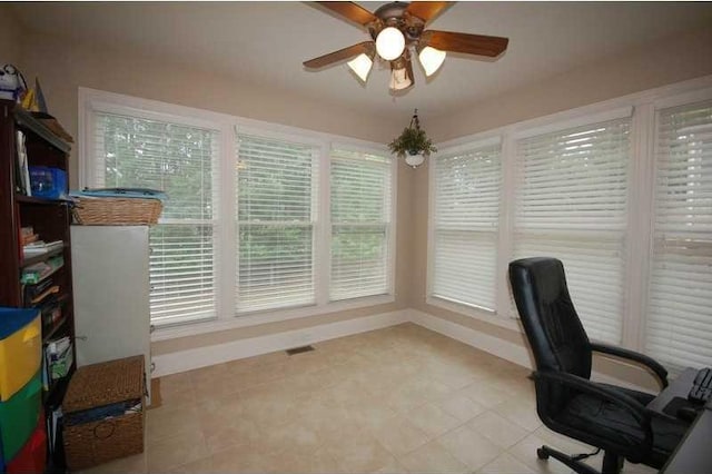 home office featuring ceiling fan and baseboards