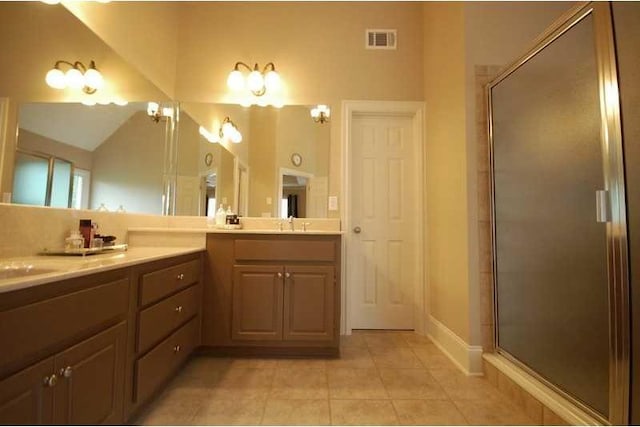 full bath with visible vents, tile patterned floors, a shower stall, and vanity