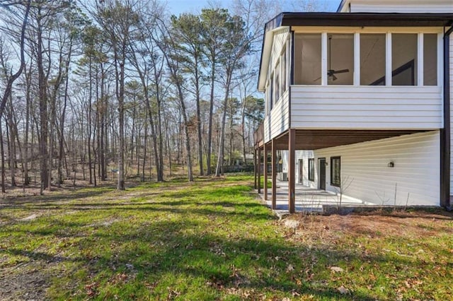 view of yard featuring a patio and a sunroom