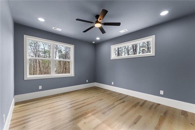 unfurnished living room with ceiling fan and light hardwood / wood-style floors