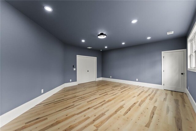 unfurnished bedroom with ceiling fan and light hardwood / wood-style flooring