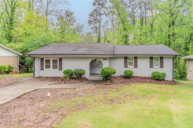 2682 Cavalier Dr, Decatur, GA 30034 - ranch-style home with roof with shingles, driveway, a front lawn, and brick siding