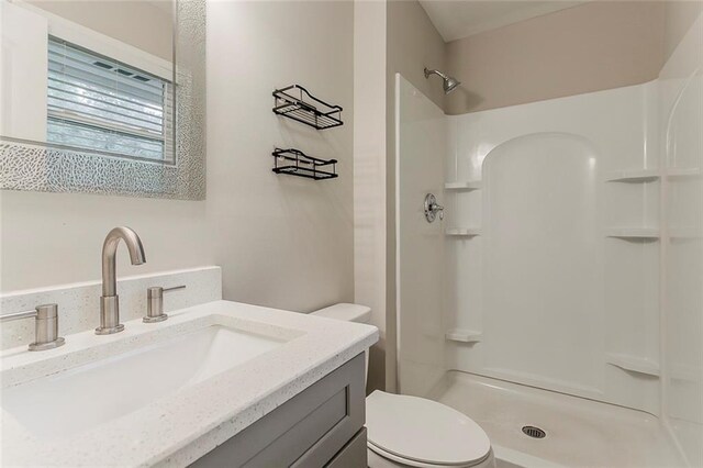 2682 Cavalier Dr, Decatur, GA 30034 - bathroom with toilet, vanity, and walk in shower