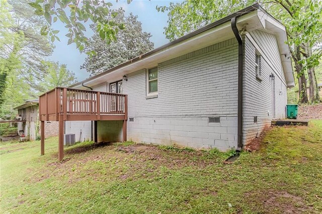 2682 Cavalier Dr, Decatur, GA 30034 - view of side of property featuring crawl space, central AC unit, brick siding, a deck, and a lawn