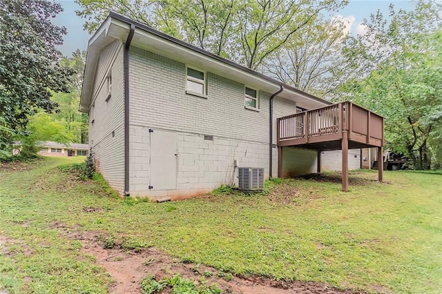 2682 Cavalier Dr, Decatur, GA 30034 - rear view of property with brick siding, a lawn, a deck, and central AC