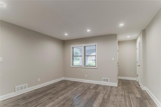 2682 Cavalier Dr, Decatur, GA 30034 - spare room with visible vents, baseboards, recessed lighting, and wood finished floors