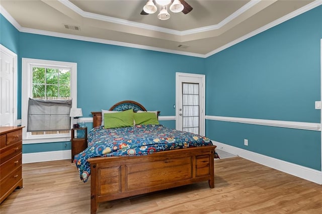 4594 Poplar Rd, Pine Lake, GA 30072 - bedroom with wood finished floors, crown molding, a ceiling fan, and a tray ceiling