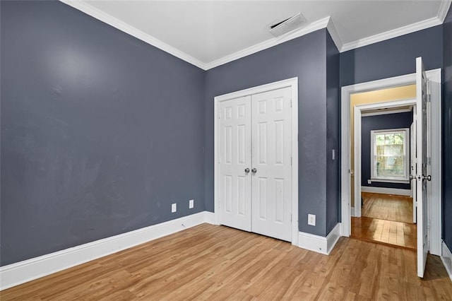 4594 Poplar Rd, Pine Lake, GA 30072 - unfurnished bedroom with wood finished floors, ornamental molding, and a closet