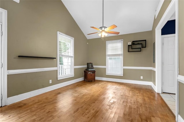 4594 Poplar Rd, Pine Lake, GA 30072 - unfurnished living room with a ceiling fan, light wood finished floors, lofted ceiling, and plenty of natural light