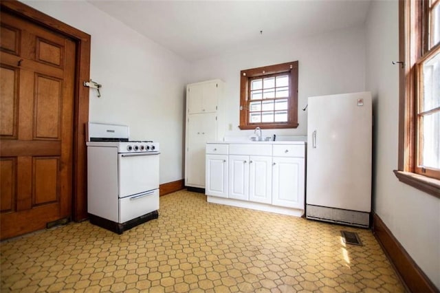 kitchen with sink and white appliances