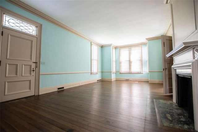 unfurnished living room with dark wood-type flooring and ornamental molding