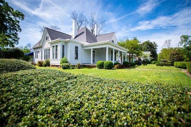 view of property exterior featuring a lawn