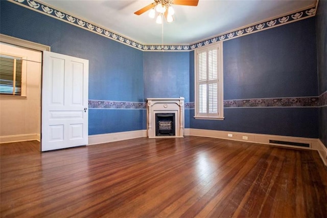 unfurnished living room featuring wood-type flooring and ceiling fan