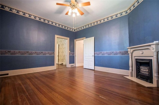 unfurnished living room featuring hardwood / wood-style flooring and ceiling fan