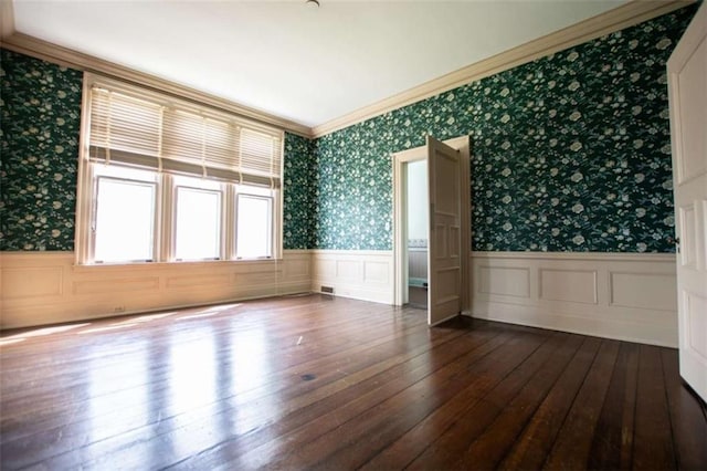 unfurnished room with crown molding and hardwood / wood-style floors