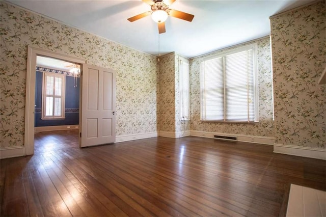 unfurnished room featuring ceiling fan and dark hardwood / wood-style flooring