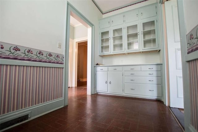 bar with white cabinetry