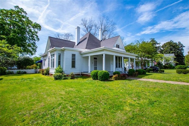 view of front facade with a porch and a front yard