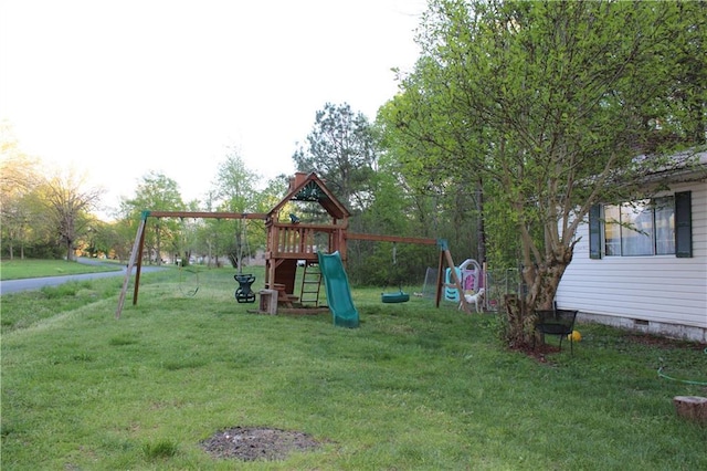 view of playground with a lawn