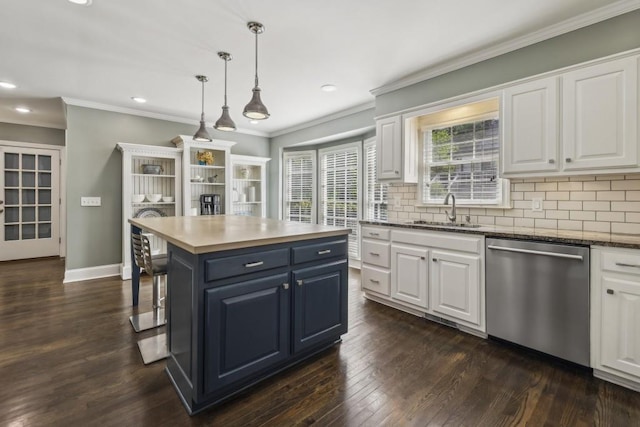 kitchen featuring dishwasher, a sink, white cabinets, crown molding, and recessed lighting