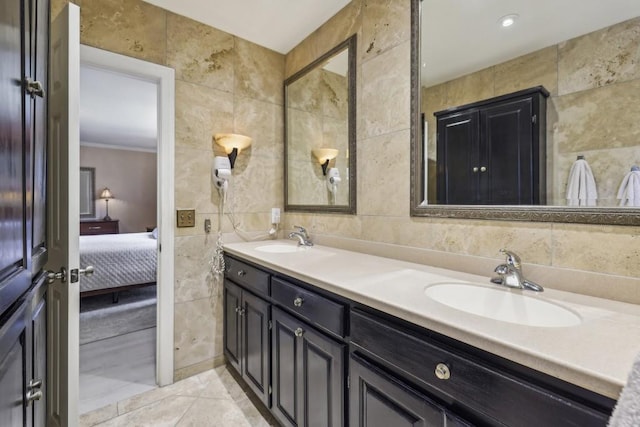 ensuite bathroom with tile walls and double vanity