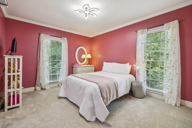 bedroom featuring crown molding, carpet floors, and baseboards
