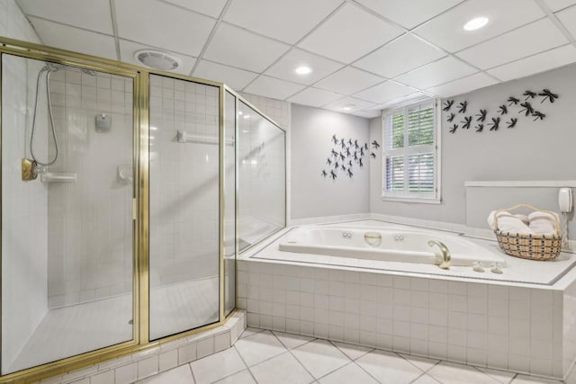 full bathroom with a garden tub, tile patterned floors, and a stall shower