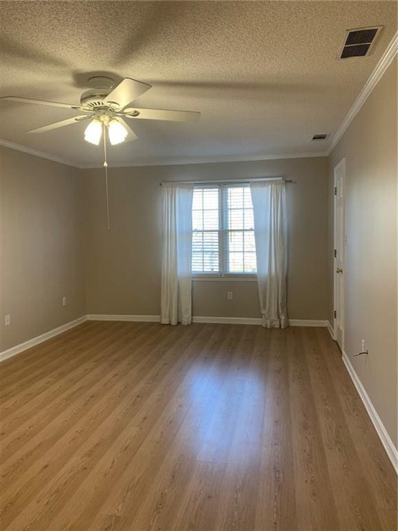 240 W Huntington Rd, Bogart, GA 30622 - unfurnished room with crown molding, a textured ceiling, ceiling fan, wood finished floors, and baseboards