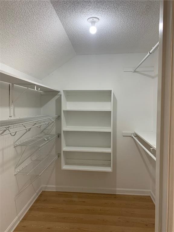 240 W Huntington Rd, Bogart, GA 30622 - spacious closet with wood finished floors and lofted ceiling