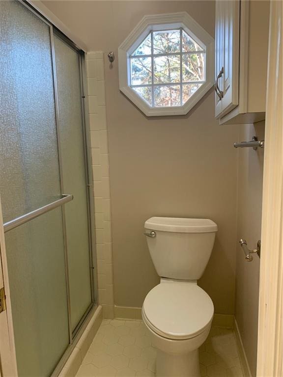 240 W Huntington Rd, Bogart, GA 30622 - full bath with tile patterned floors, toilet, a stall shower, and baseboards