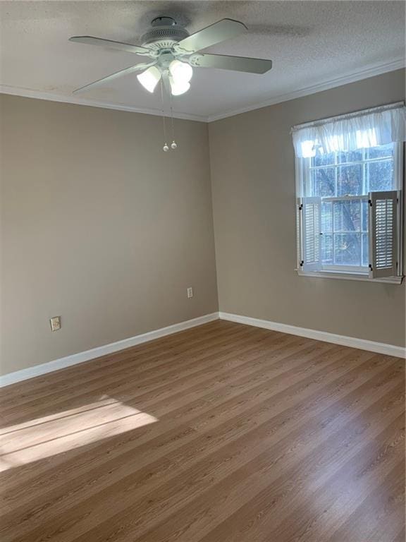 240 W Huntington Rd, Bogart, GA 30622 - spare room with ornamental molding, a ceiling fan, wood finished floors, baseboards, and a textured ceiling