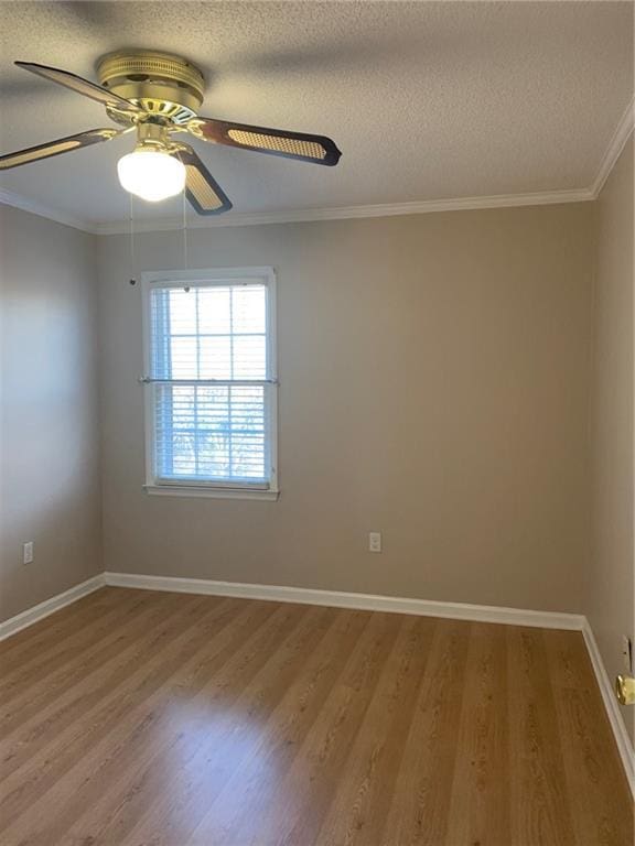 240 W Huntington Rd, Bogart, GA 30622 - empty room featuring light wood-style floors, a ceiling fan, ornamental molding, a textured ceiling, and baseboards