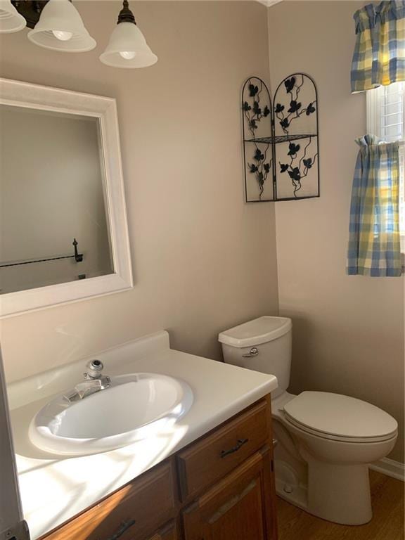 240 W Huntington Rd, Bogart, GA 30622 - half bath with vanity, toilet, and wood finished floors