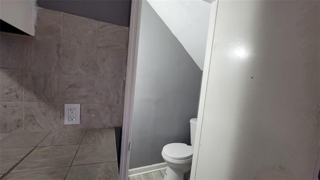 bathroom featuring tile patterned floors and toilet