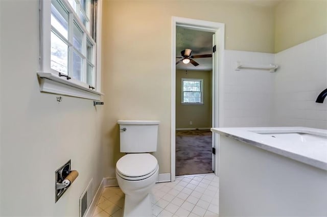 516 Jordan Dr NW, Tucker, GA 30084 - bathroom with vanity, a ceiling fan, and tile patterned flooring