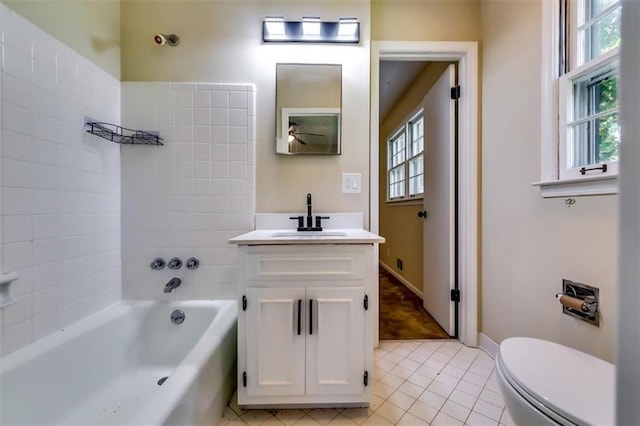 516 Jordan Dr NW, Tucker, GA 30084 - full bath featuring vanity, plenty of natural light, tile patterned flooring, and a ceiling fan